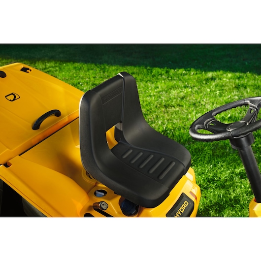 CubCadet 13AB21HD603 lawn tractor seat and steering wheel, close-up angle, yellow body.