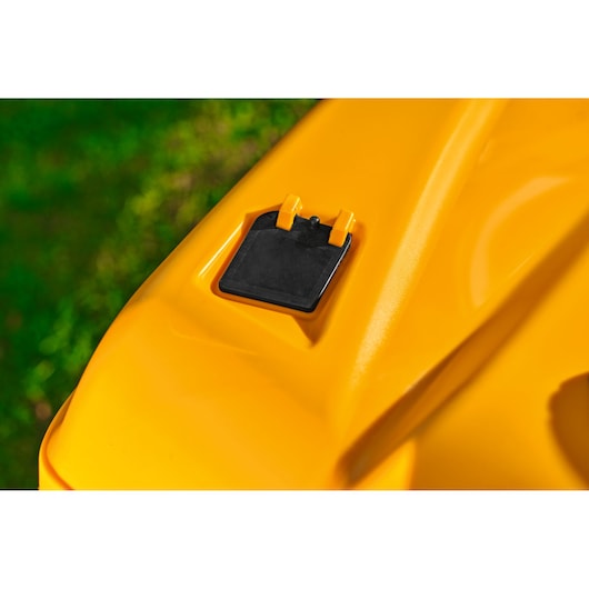 CubCadet 13AB21HD603 mower yellow deck with black cover, close-up outdoor angle.