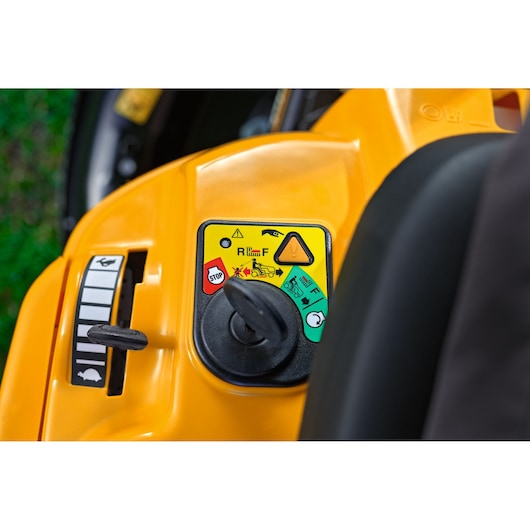 CubCadet 13AB21HD603 control panel close-up with colored buttons on yellow lawn mower body.