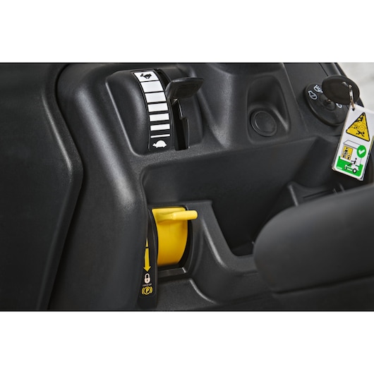 CubCadet LT2-NR92 13AB71BE603 mower control panel close-up with ignition, throttle, and yellow parking brake lever.