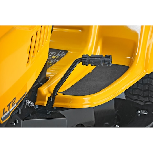CubCadet LT2-NR92 SKU 13AB71BE603 lawn tractor close-up side view showing the pedal and footrest.