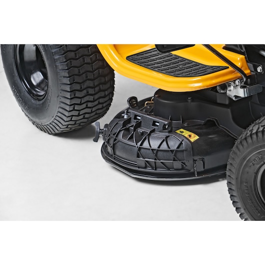CubCadet 13AB78BY603 LT2-NS92 tractor mower deck close-up, black and yellow parts, left side view.