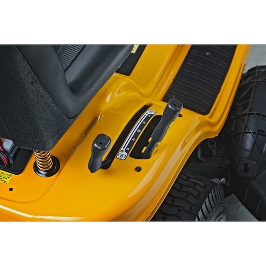 CubCadet 13AB78BY603 LT2-NS92 lawn tractor control levers close-up, yellow body, photography, top angle.