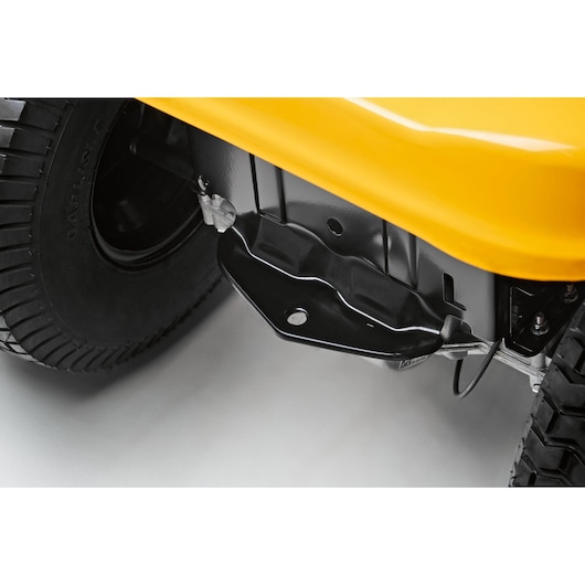 CubCadet LT2-NS92 13AB78BY603 lawn tractor close-up of yellow body and wheel assembly, angled view.