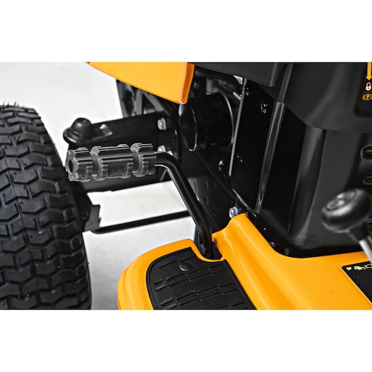 CubCadet LT2-NS92 SKU 13AB78BY603 lawn mower pedal and wheel detail, side angle, on white background.