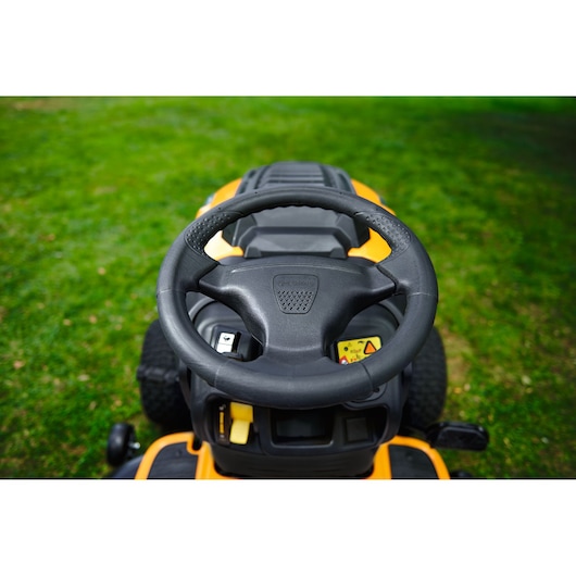 CubCadet LT3-PR105 13AJ71BN603 lawn tractor steering wheel, close-up view outdoors on grass.