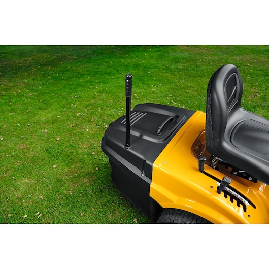 CubCadet LT3-PR105 13AJ71BN603 riding lawn mower rear and seat, yellow and black, side angle.