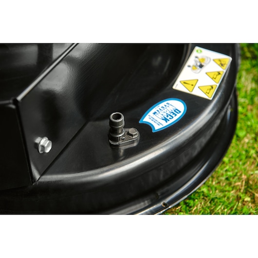 CubCadet LT3-PR105 lawn tractor deck detail with hose connector and warning stickers, close-up angle.