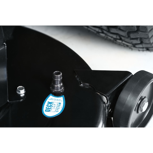 CubCadet 13AJ71BN603 LT3-PR105 mower deck wash port, close-up, showing black plastic connector and label.