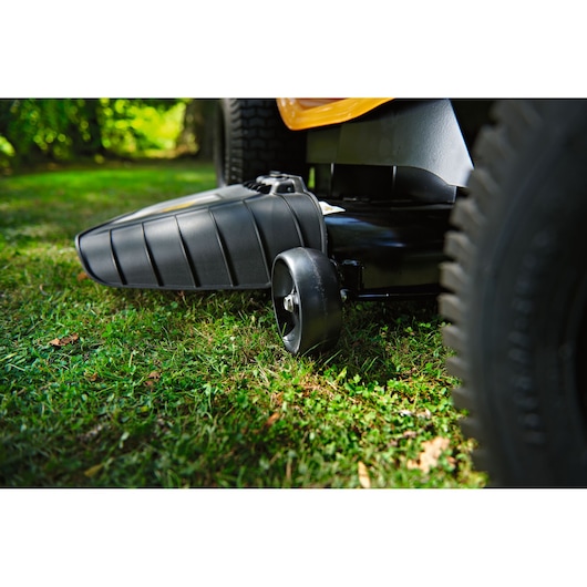 CubCadet LT3-PR105 13AJ71BN603 lawn tractor side photography showing black discharge chute and wheel.