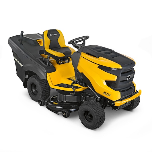 CubCadet 13AJA1TR603 ride-on lawn mower, yellow and black, side angle photo, grass bag attachment visible.