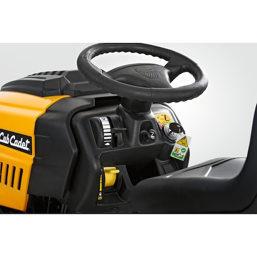 CubCadet LT3-PS107 13AY78BS603 lawn tractor close-up showing steering wheel and dashboard controls.