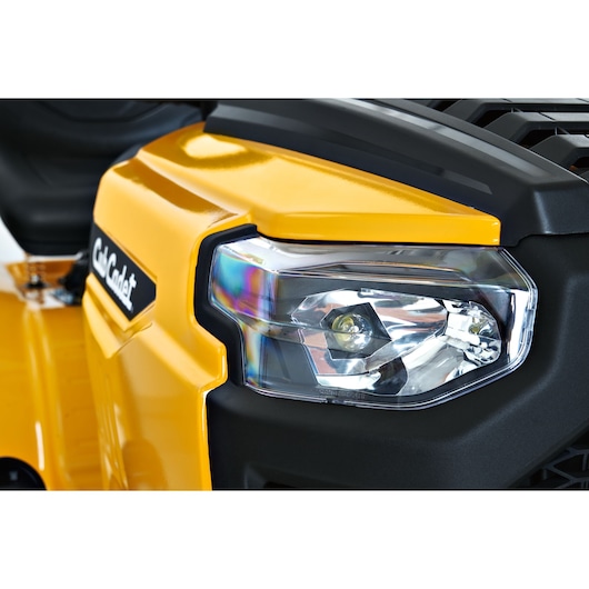 CubCadet LT3-PS107 13AY78BS603 lawn tractor headlight and front grill, close-up, yellow and black finish.