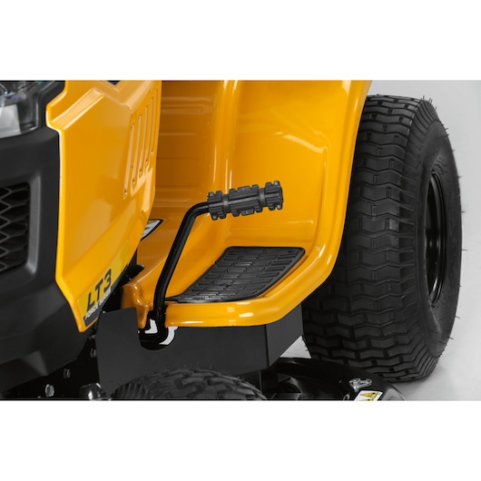CubCadet 13AY78BS603 LT3-PS107 lawn tractor pedal and tire close-up, side angle on white background.