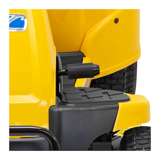 CubCadet 13B726HD603 photography of yellow lawn tractor side pedal and tread plate, white background.