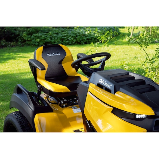 CubCadet 14AFA5TQ603 yellow riding lawn mower front side angle, black seat and steering wheel.