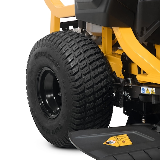 CubCadet 17AAGBYE603 XZ6-S107 rear tire and frame close-up, yellow body, black tread, studio angle.