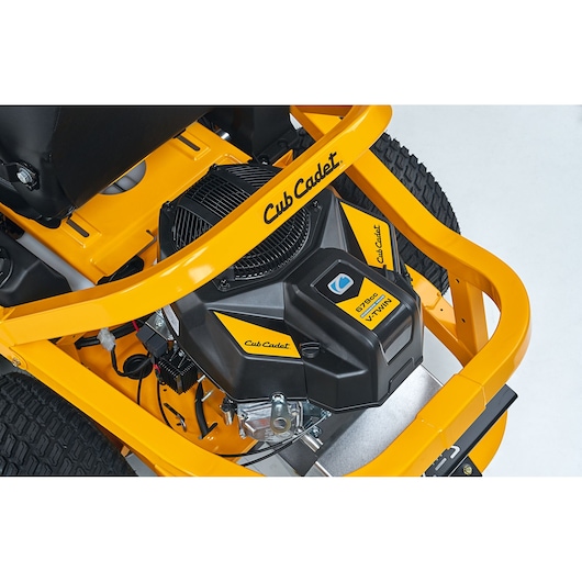 Cub Cadet 17BAEACS603 lawn mower engine close-up, showing yellow frame and black engine details.