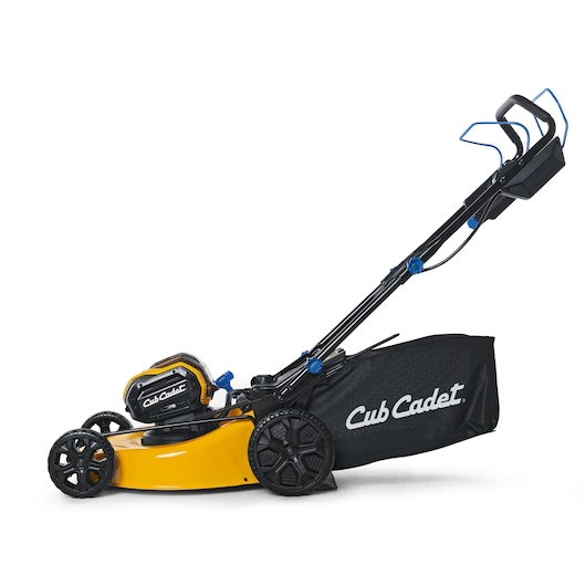 CubCadet 18ASTR94603 lawn mower side view, yellow deck and black grass bag.