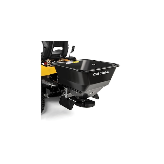 CubCadet 19A30028100 black rear-mounted spreader on mower, angled view, photo on white background.