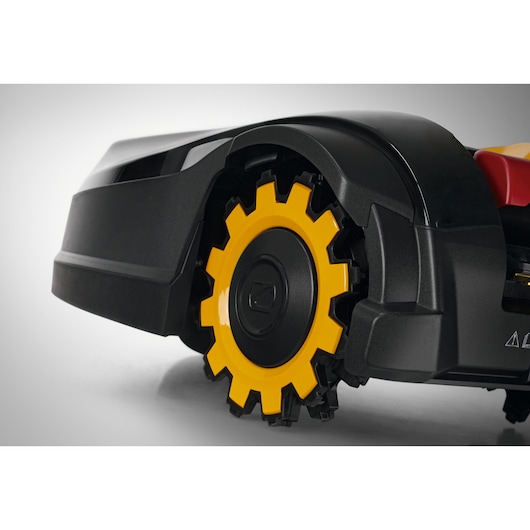 CubCadet 22AKHEFA603 photography, close-up side view of yellow and black mower wheel on white background.