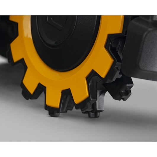 CubCadet 22AKHEFA603 lawn mower wheel close-up, yellow and black, with detailed tread on white background.