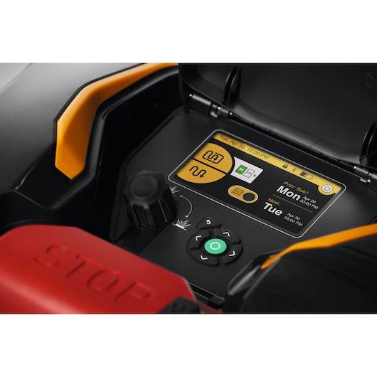 CubCadet 22AKHEFA603 lawn mower control panel close-up, showing digital screen, buttons, and stop lever.