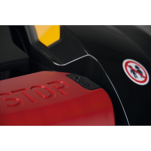 CubCadet 22AKHEFA603 mower close-up of red STOP button and warning decal, product photography.