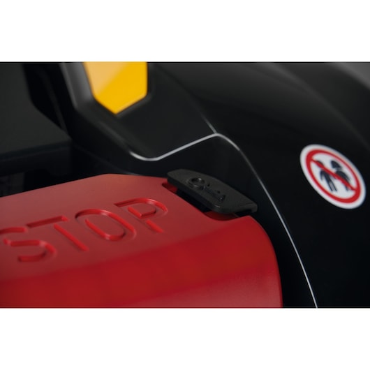 CubCadet 22AKHEFA603 photography, close-up of red STOP button and black key slot on equipment.