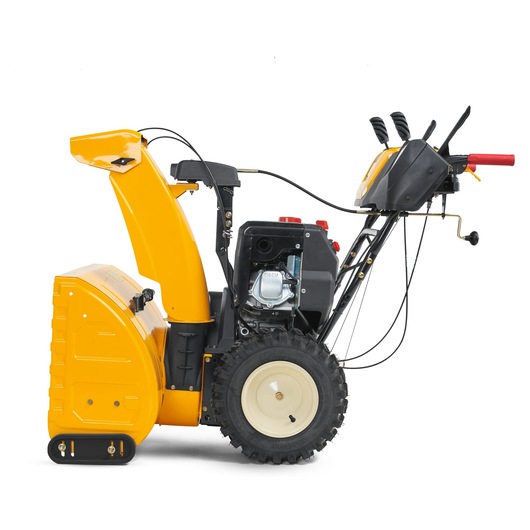 CubCadet 31AY5EVX603 yellow snow blower, side view, showing large wheels and control handles on white background.