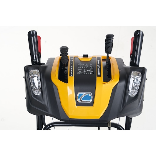 CubCadet 31AY5EVX603 snow blower control panel, yellow and black, front angle, showing handles and headlights.