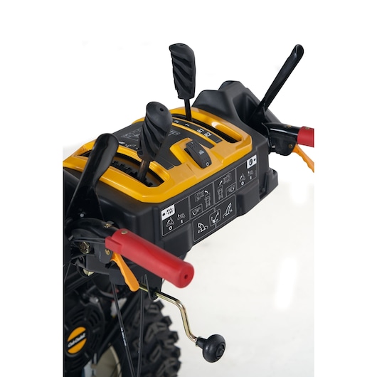 CubCadet 31AY5EVX603 snow blower control panel, close-up, showing levers and handle with yellow and red details.