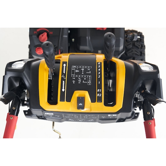 CubCadet 31AY5EVX603 snow blower control panel, yellow and black, top view with levers and gear markings.