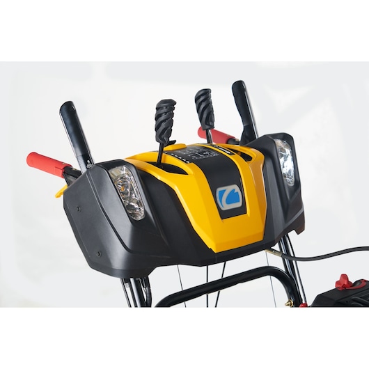 CubCadet 31AY5EVX603 snow blower control panel close-up, yellow and black with handles and levers.