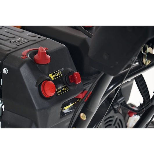 CubCadet 31AY5EVX603 snow blower control panel with red knobs and yellow labels, side angle.