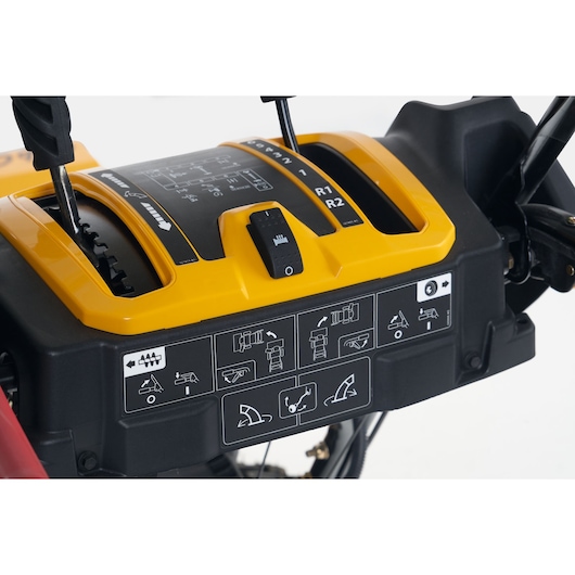 CubCadet 31AY5EVX603 photography of control panel with yellow cover and black levers, front angle.