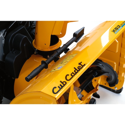 CubCadet 31AY5EVX603 yellow snow blower close-up angle, showing handle, chute, and CubCadet logo.