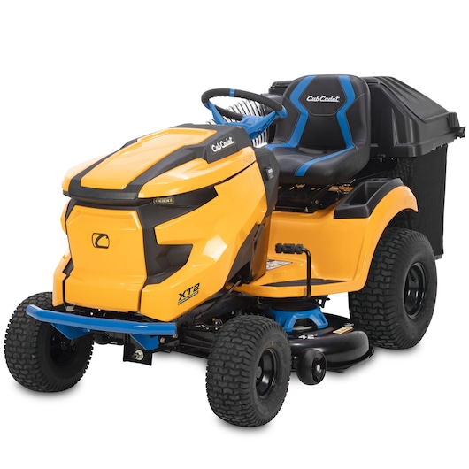 CubCadet 33ABA7ES603 lawn tractor side angle, yellow body, black and blue seat, rear grass collector.
