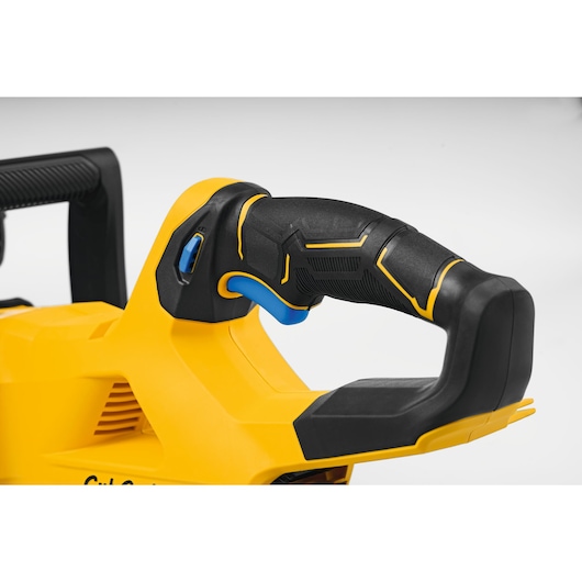 CubCadet 41AT6CGR603 detail photo of ergonomic black and yellow handle with blue trigger, front angle.