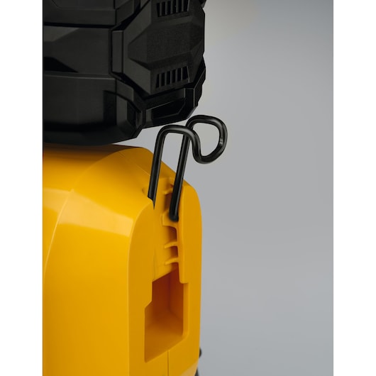 CubCadet 41AT6HK-603 photography, close-up of black clip attached to yellow equipment housing, side angle.