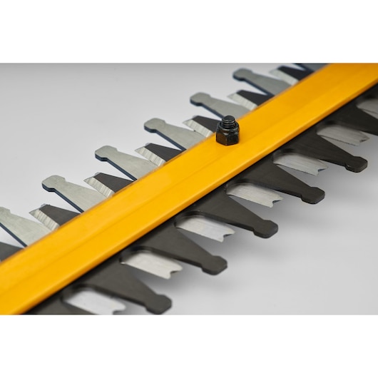 CubCadet 41AT6HK-603 hedge trimmer blade close-up showing sharp dual-action teeth and yellow blade guard.
