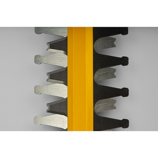 CubCadet 41AT6HK-603 hedge trimmer blade detail, close-up with yellow guard, metal teeth visible.