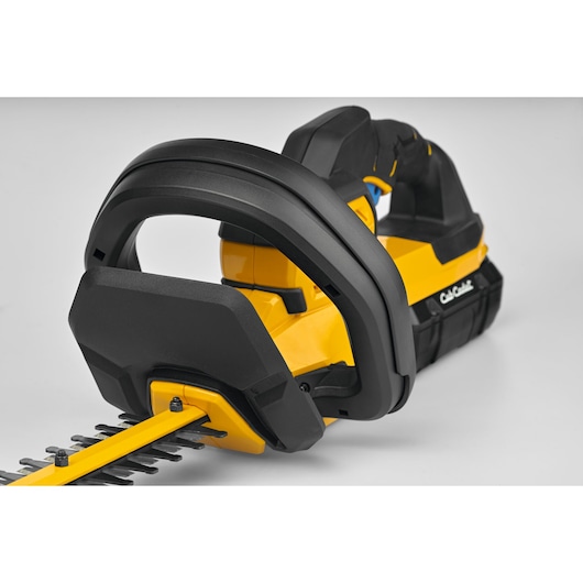 CubCadet 41AT6HK-603 hedge trimmer close-up, yellow and black, showing handle and blade, white background.