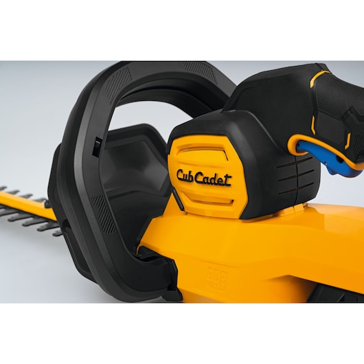 CubCadet 41AT6HK-603 hedge trimmer close-up, yellow and black handle with visible branding, white background.