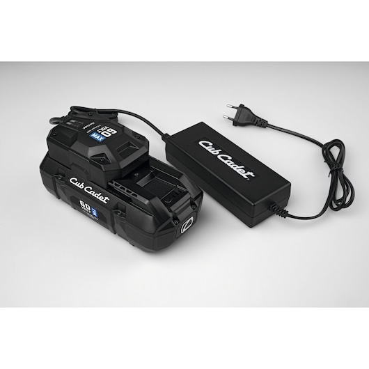 Cub Cadet 49AL601-603 black 60V lithium battery and charger, angled view on white background.
