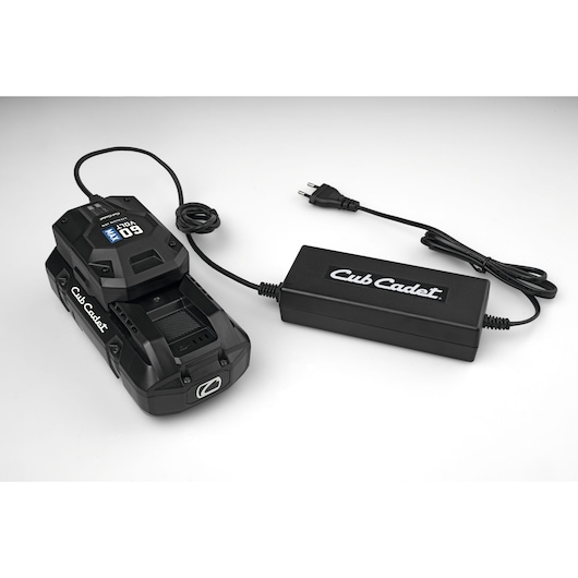 Cub Cadet 49AL601-603 battery charger and power adapter on white background, angled view.