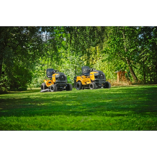CubCadet LT3-PR105 SKU 13AJ71BN603 yellow lawn tractors on grass outdoors, side view.